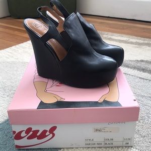 Jeffrey Campbell black leather platform wedges.